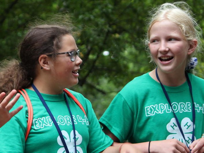 two young 4-H kids walking and talking as they walk together
