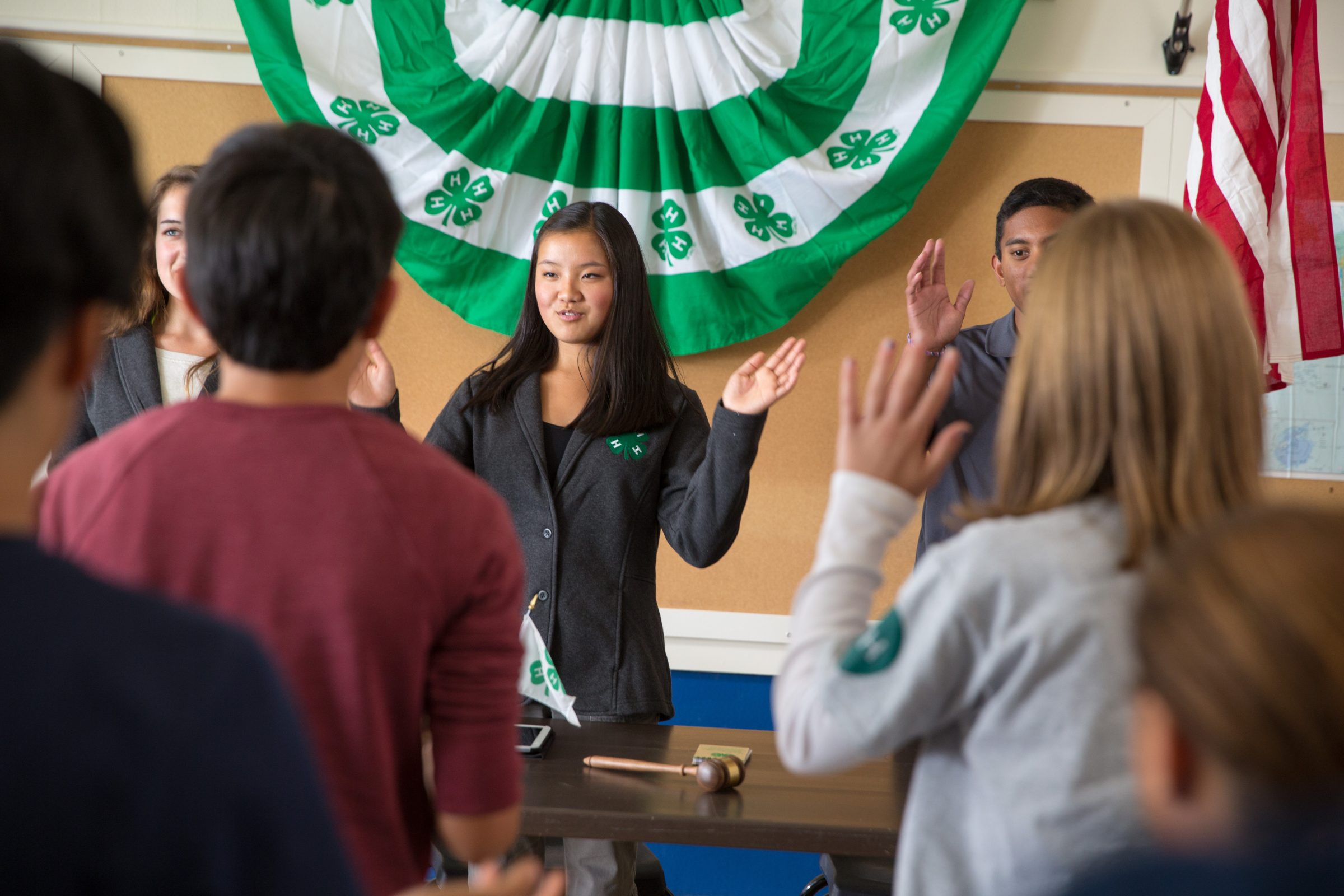 group of 4-H club officers and members, attending a club meeting